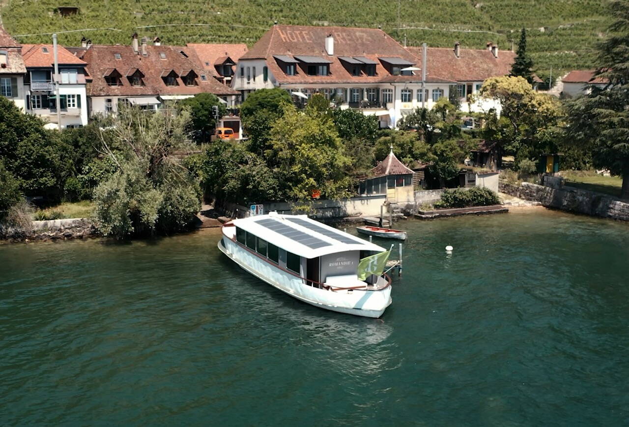 gourmetschiff-village-vineyard-lake-biel.jpg Romandie I – 1952 beside a wine-growing village on Lake Biel, with solar panels visible on the roof.